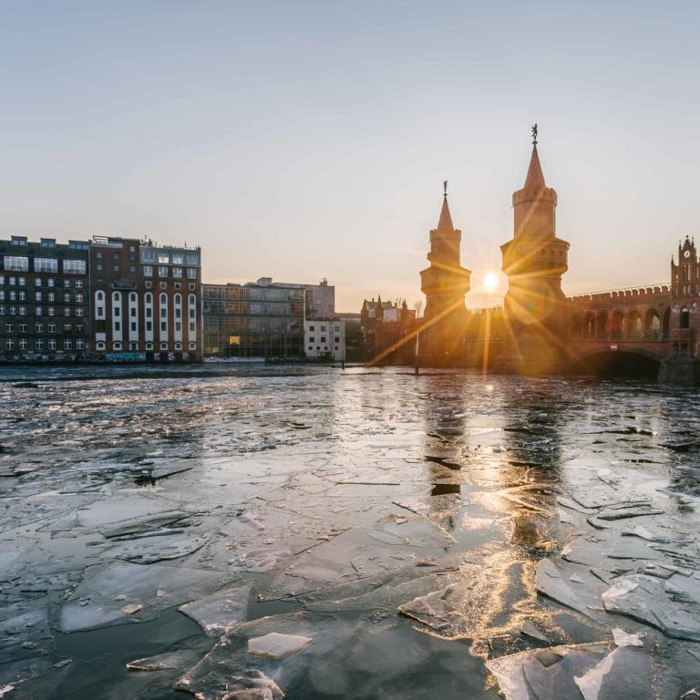 Spree frozen over in winter Christmas market on the Spree